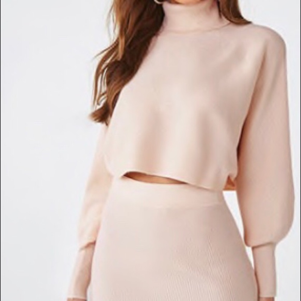 Nude pink sweater and mini skirt set.